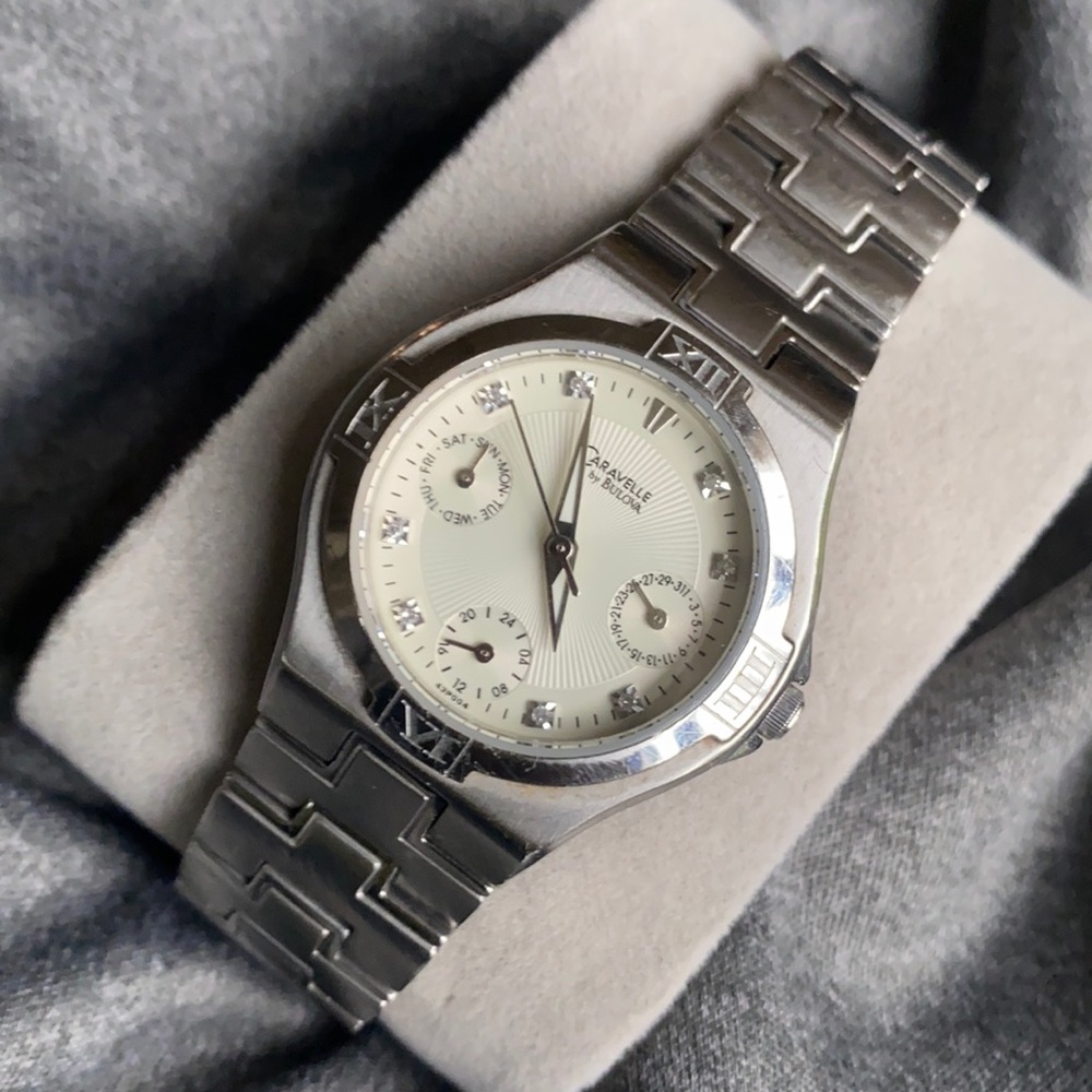 Caravelle By Bulova women’s silver watch with white face. Chronograph.
